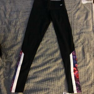 Pink yoga leggings with floral calf cutouts